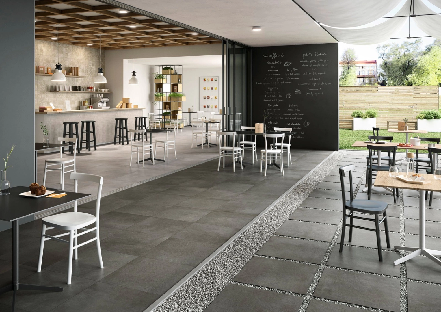 Wielkoformatowy gres Marazzi Plaster efekt beton w salonie z kominkiem