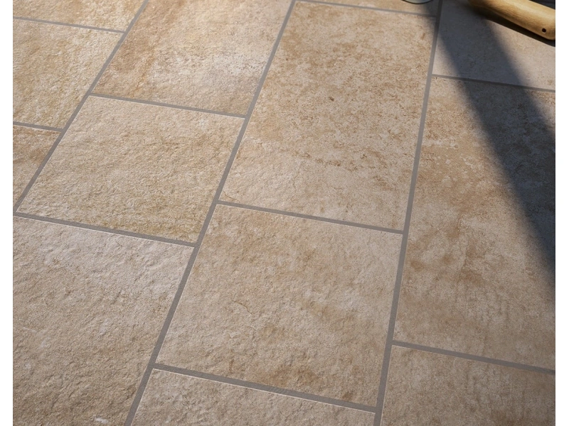 Płytki gresowe Marazzi Pietra Occitana efekt kamień naturalny w eleganckim salonie z dużymi przeszkleniami